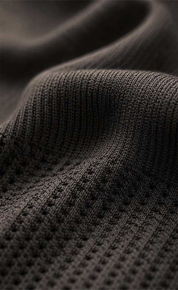 Close-up of seamless knit fabric with integrated mesh ventilation zones